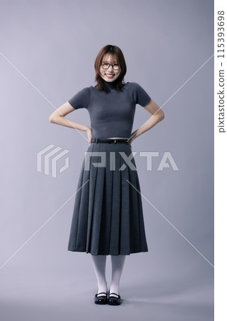 A Korean Woman in Her 20s Poses in a Neat Gray Costume With Glasses 115393698