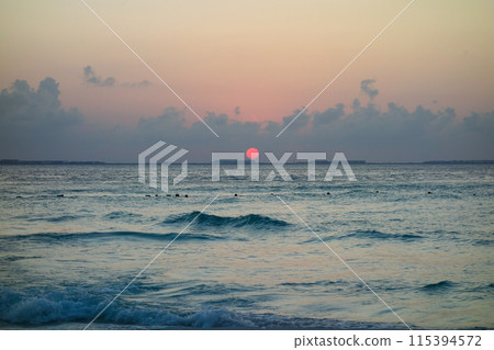 beautiful dramatic sunset over the sea waters beautiful dramatic sunset over the sea waters 115394572