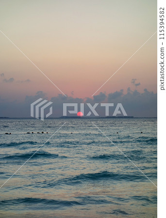 beautiful dramatic sunset over the sea waters beautiful dramatic sunset over the sea waters 115394582
