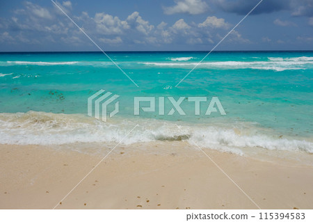 Turquoise waters of the Caribbean Sea in Cancun, Mexico. Hotel zone beach Turquoise waters of the Caribbean Sea in Cancun, Mexico. Hotel zone beach 115394583