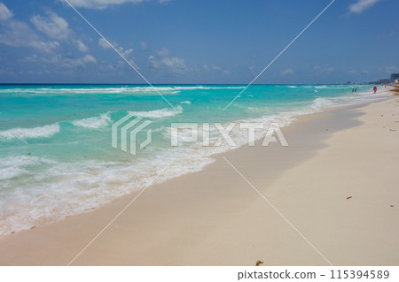 Turquoise waters of the Caribbean Sea in Cancun, Mexico. Hotel zone beach Turquoise waters of the Caribbean Sea in Cancun, Mexico. Hotel zone beach 115394589