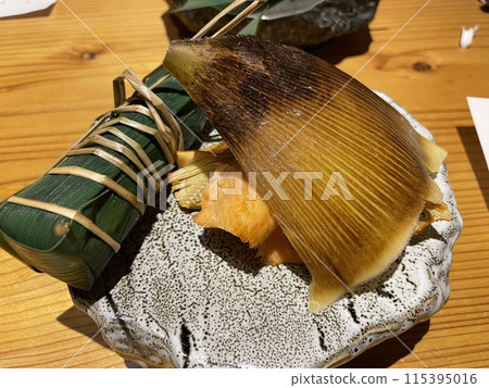 Striped bass sushi with grilled bamboo shoots and grilled salted salmon Striped bass sushi with grilled bamboo shoots and grilled salted salmon 115395016