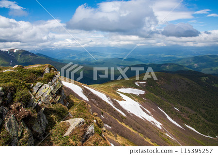 Spectacular view of mountains covered with snow in summer Spectacular view of mountains covered with snow in summer 115395257