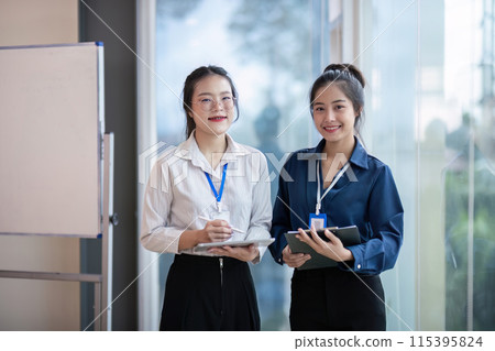 Professional Business Team Meeting Colleagues in Modern Office Setting with Digital Devices and Whiteboard for Collaborative Work Professional Business Team Meeting Colleagues in Modern Office Setting with Digital Devices and Whiteboard for Collaborative Work 115395824