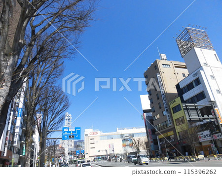 A clear spring sky and the downtown area in front of Kofu Station 115396262