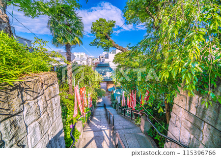 Yokohama cityscape in Japan in June. After passing through the shopping street in front of Gyōmyōji Station. View of Gyōmyōji Temple and the stairs. 115396766