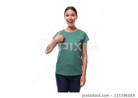 young slender european woman with ponytail hairstyle dressed in green t-shirt draws attention to 115396889