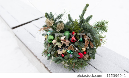 Christmas Wreath on Wooden Bench 115396941