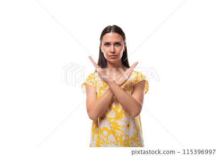European woman with straight flowing black hair crossed her arms in front of her 115396997
