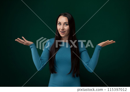 Woman in Blue Dress Holding Hands Out Woman in Blue Dress Holding Hands Out 115397012