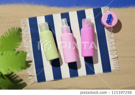 Means for safe tanning, on the background of the sea, flatlay. Means for safe tanning, on the background of the sea, flatlay. 115397298