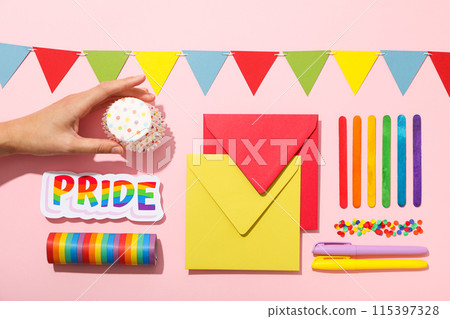 LGBT parade concept, holiday symbols on pink background. LGBT parade concept, holiday symbols on pink background. 115397328