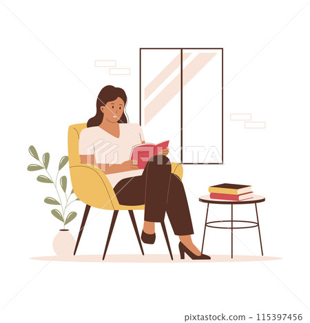 Woman reading a book sitting on a sofa next to the window 115397456
