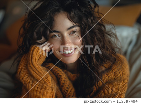 Young Girl Smiling With a Green Smoothie at a Cafe 115397494