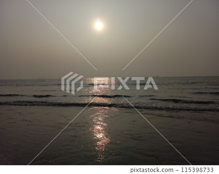 Panoramic view of the beach landscape. Inspirational horizon of a tropical beach seascape. The orange and golden sunset sky brings tranquillity, relaxation, and a summery mood. 115398733