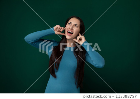 Woman in Blue Dress Making Funny Face Woman in Blue Dress Making Funny Face 115398757