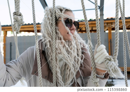 Woman With Long White Hair on Rope Woman With Long White Hair on Rope 115398860