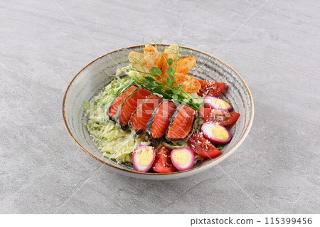 Salad with salmon, lettuce and balsamic vinegar. Healthy food, fresh green salad. 115399456