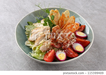 Caesar Salad: Classic salad with romaine lettuce, croutons, Parmesan, and Caesar dressing. 115399489