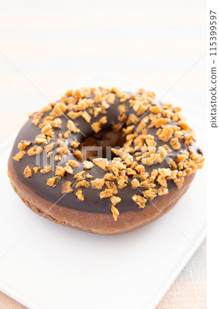Delicious crunchy chocolate donuts Delicious crunchy chocolate donuts 115399597