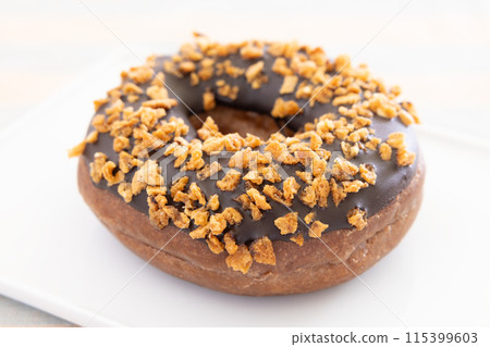 Delicious chocolate crunch donuts Delicious chocolate crunch donuts 115399603