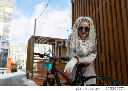 Woman in White Wig and Gloves Standing by Bicycle Woman in White Wig and Gloves Standing by Bicycle 115399771
