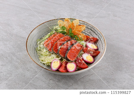 Salad with salmon, lettuce and balsamic vinegar. Healthy food, fresh green salad. 115399827