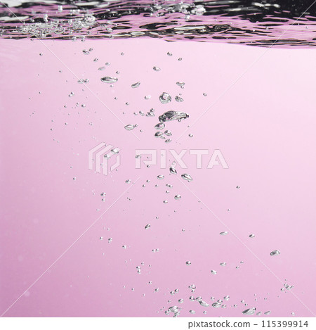 Different waves of air bubbles caused by falling water on a colorful background. 115399914