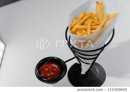 French fries with ketchup on a stand French fries with ketchup on a stand 115400608