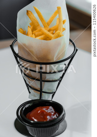 French fries with ketchup on a stand French fries with ketchup on a stand 115400626