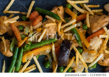 Salad with vegetables, meat and French fries Salad with vegetables, meat and French fries 115400705