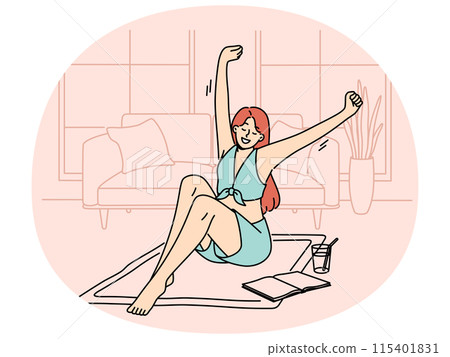 Smiling woman relax at home with book and drink 115401831