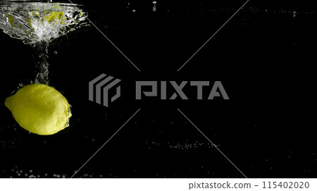 Fresh fruit falling into the water. Organic fruits for making effective juices for dieting. 115402020