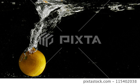 Fresh fruit falling into the water. Organic fruits for making effective juices for dieting. 115402038