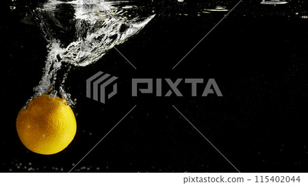 Fresh fruit falling into the water. Organic fruits for making effective juices for dieting. Fresh fruit falling into the water. Organic fruits for making effective juices for dieting. 115402044