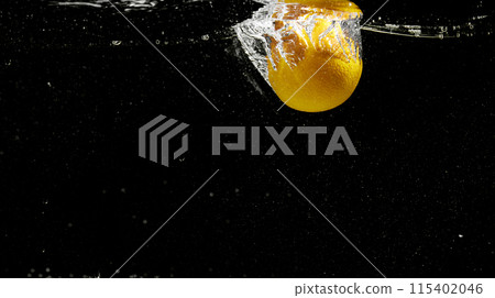 Fresh fruit falling into the water. Organic fruits for making effective juices for dieting. 115402046