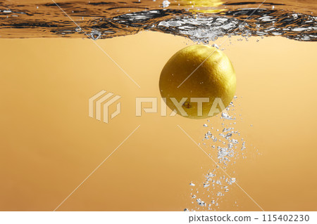 Fresh fruit falling into the water. Organic fruits for making effective juices for dieting. 115402230
