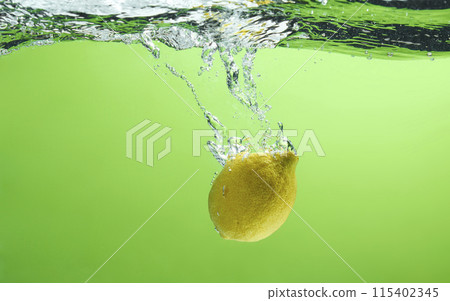 Fresh fruit falling into the water. Organic fruits for making effective juices for dieting. 115402345