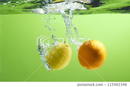 Fresh fruit falling into the water. Organic fruits for making effective juices for dieting. 115402346