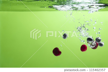 Fresh fruit falling into the water. Organic fruits for making effective juices for dieting. Fresh fruit falling into the water. Organic fruits for making effective juices for dieting. 115402357