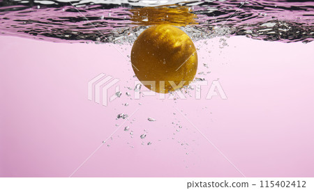 Fresh fruit falling into the water. Organic fruits for making effective juices for dieting. 115402412