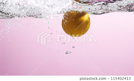 Fresh fruit falling into the water. Organic fruits for making effective juices for dieting. 115402413