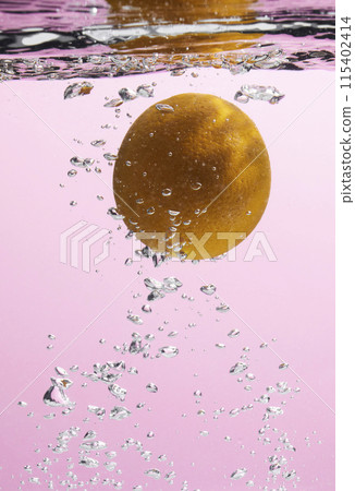 Fresh fruit falling into the water. Organic fruits for making effective juices for dieting. 115402414