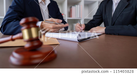 Professional Lawyer Signing Business Contract with Client in Office, Legal Agreement, Business Deal, Corporate Law, Attorney Consulting, Legal Services, Business Partnership, Contract Signing 115403828