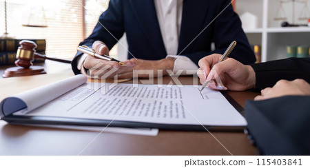 Professional Lawyer Signing Contract with Client in Office. Business Agreement, Legal Services, and Corporate Deal Concept Professional Lawyer Signing Contract with Client in Office. Business Agreement, Legal Services, and Corporate Deal Concept 115403841