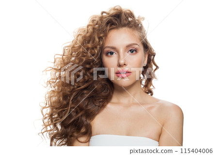 Elegant young woman with natural make-up, clear fresh skin and wavy hairstyle on white background 115404006