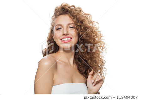 Laughing fashion model with frizzy hair, natural makeup and healthy clean skin posing  115404007
