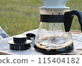 Brewing coffee outdoors on the lawn 115404182