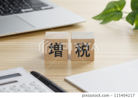 A building block with the words "Tax Increase" written on it A building block with the words "Tax Increase" written on it 115404217