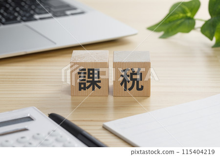 A building block with the word tax written on it A building block with the word tax written on it 115404219